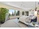 Main bedroom with large windows offering panoramic mountain views at 6123 Buffalo Run, Littleton, CO 80125