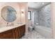 Elegant bathroom with marble tile and a patterned wall at 6123 Buffalo Run, Littleton, CO 80125