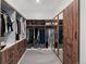 Large walk-in closet with ample shelving and drawer space at 6123 Buffalo Run, Littleton, CO 80125