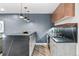 Basement wet bar with dark countertops and wood cabinets at 6123 Buffalo Run, Littleton, CO 80125
