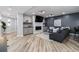 Finished basement with a cozy living area and fireplace at 6123 Buffalo Run, Littleton, CO 80125