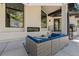 Outdoor patio with seating area and built-in fireplace at 6123 Buffalo Run, Littleton, CO 80125