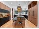 Open concept kitchen with contemporary design and island seating at 6123 Buffalo Run, Littleton, CO 80125