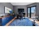 Modern home office with blue cabinetry and a view at 6123 Buffalo Run, Littleton, CO 80125