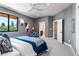 Spacious bedroom with a large window and en-suite bathroom at 6123 Buffalo Run, Littleton, CO 80125