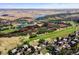 Community view showcasing the red rocks golf course and lake at 6123 Buffalo Run, Littleton, CO 80125