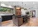 Spacious kitchen with custom cabinetry and large island at 6123 Buffalo Run, Littleton, CO 80125