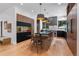 Modern kitchen with an island, dark countertops, and wood cabinets at 6123 Buffalo Run, Littleton, CO 80125