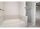 Modern bathroom with soaking tub and a separate shower at 5483 S Versailles St, Aurora, CO 80015