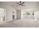 Bright main bedroom featuring a bay window and walk-in closet at 5483 S Versailles St, Aurora, CO 80015