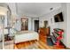 Primary bedroom with hardwood floors and ensuite bathroom access at 925 N Lincoln St # 14C, Denver, CO 80203