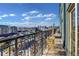 Urban balcony view with cityscape and mountains in the distance at 925 N Lincoln St # 14C, Denver, CO 80203