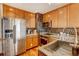 Modern kitchen with stainless steel appliances and wood flooring at 925 N Lincoln St # 14C, Denver, CO 80203