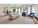 Spacious living room with comfy seating and large windows at 1150 Inca St # 27, Denver, CO 80204