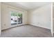Spacious bedroom with patio access and neutral carpeting at 1150 Inca St # 27, Denver, CO 80204