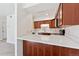 Modern kitchen with quartz countertops and wood cabinets at 1150 Inca St # 27, Denver, CO 80204