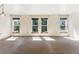 Spacious living room featuring large windows and neutral carpeting at 1150 Inca St # 27, Denver, CO 80204