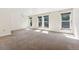 Spacious living room with large windows and ample natural light at 1150 Inca St # 27, Denver, CO 80204