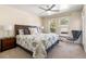 Main bedroom with a king-size bed and lots of natural light at 1150 Inca St # 27, Denver, CO 80204