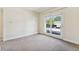 Bright bedroom with double doors leading to a balcony at 1150 Inca St # 27, Denver, CO 80204