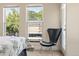 Bright bedroom with treetop views and balcony access at 1150 Inca St # 27, Denver, CO 80204