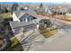 Two-story house with a large backyard, driveway, and mountain views at 1265 Button Rock Dr, Longmont, CO 80504