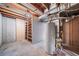 Unfinished basement with water heater and ample storage at 1340 Daphne St, Broomfield, CO 80020