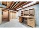 Basement workshop with pegboard and built-in workbench at 1340 Daphne St, Broomfield, CO 80020