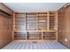 Built-in wooden shelving unit in a carpeted room at 1340 Daphne St, Broomfield, CO 80020