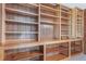 Built-in wooden shelving unit with multiple shelves for storage at 1340 Daphne St, Broomfield, CO 80020