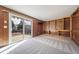 Gathering room with built-in shelving and sliding glass doors at 1340 Daphne St, Broomfield, CO 80020