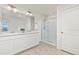 Clean bathroom with double vanity and shower at 109 Racer St, Bennett, CO 80102