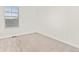 Empty bedroom with a window and carpet at 109 Racer St, Bennett, CO 80102