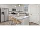 Kitchen island with granite countertop and seating for two at 109 Racer St, Bennett, CO 80102