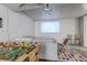 Finished basement featuring a projector and foosball table at 6428 Newcombe St # A, Arvada, CO 80004