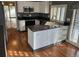 Eat-in kitchen with island, stainless steel appliances, and dark countertops at 3333 E Florida Ave # 120, Denver, CO 80210