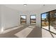 Bedroom with large windows offering scenic views and carpeted floors at 5044 Mcclure Ln, Castle Rock, CO 80108