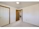 Simple bedroom with a view into another bedroom at 4828 S Owens Way, Littleton, CO 80127