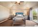 Main bedroom with plush carpet and access to a deck at 4581 Whitehall Ln, Highlands Ranch, CO 80126