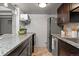 Modern kitchen with stainless steel appliances and granite counters at 100 S Clarkson St # 105, Denver, CO 80209