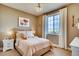 Charming bedroom with a peach comforter and decorative pillows at 738 Sunflower Dr, Brighton, CO 80601