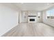 Living room with hardwood floors and a fireplace at 827 Goodrich Peak St, Erie, CO 80516