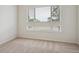 Bright bedroom with neutral carpeting and large windows at 487 Interlocken Blvd # 102, Broomfield, CO 80021