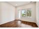 Bright bedroom with hardwood floors and large windows at 487 Interlocken Blvd # 102, Broomfield, CO 80021