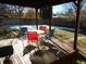 Covered patio with table and chairs, overlooking the backyard at 12484 E Alaska Ave, Aurora, CO 80012