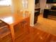 Small dining area with wood table and chairs, near kitchen at 12484 E Alaska Ave, Aurora, CO 80012