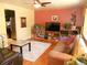 Living room with hardwood floors, leather sofas, and built-in shelving at 12484 E Alaska Ave, Aurora, CO 80012