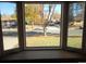 Bay window view of a residential street with parked cars and trees at 12484 E Alaska Ave, Aurora, CO 80012