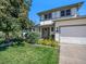 Two story house with attached garage and landscaped yard at 11022 E Fair Cir, Englewood, CO 80111