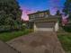 Two story house with attached garage and landscaped yard at 11022 E Fair Cir, Englewood, CO 80111